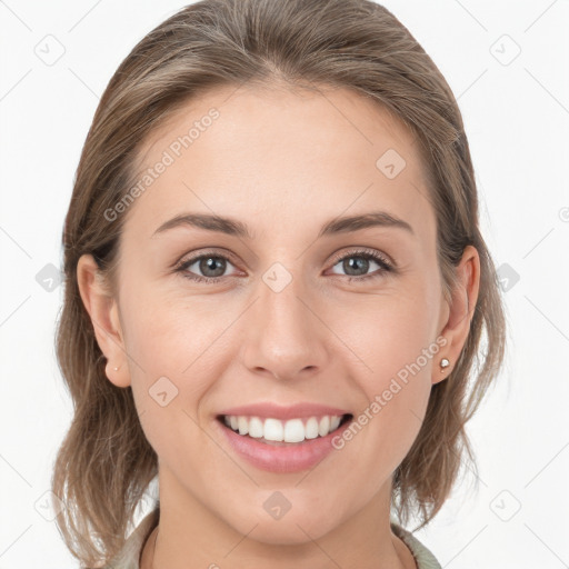 Joyful white young-adult female with medium  brown hair and grey eyes