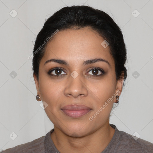 Joyful latino young-adult female with short  black hair and brown eyes