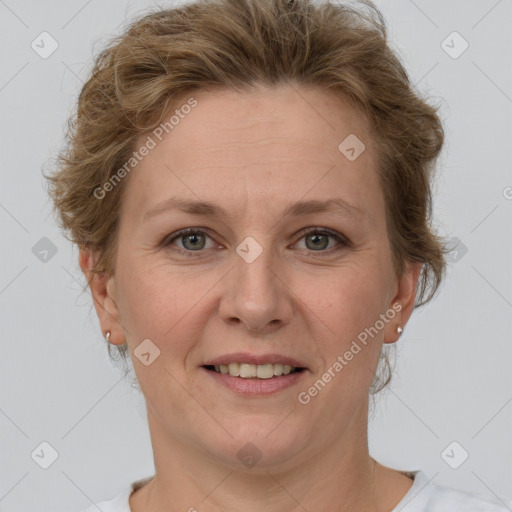 Joyful white adult female with short  brown hair and grey eyes