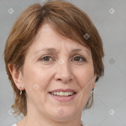 Joyful white adult female with medium  brown hair and grey eyes