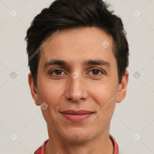 Joyful white adult male with short  brown hair and brown eyes