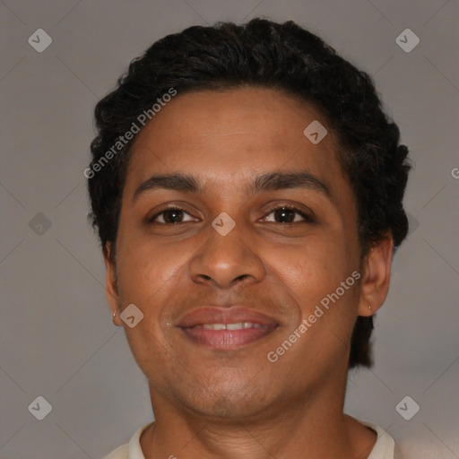 Joyful black adult male with short  brown hair and brown eyes