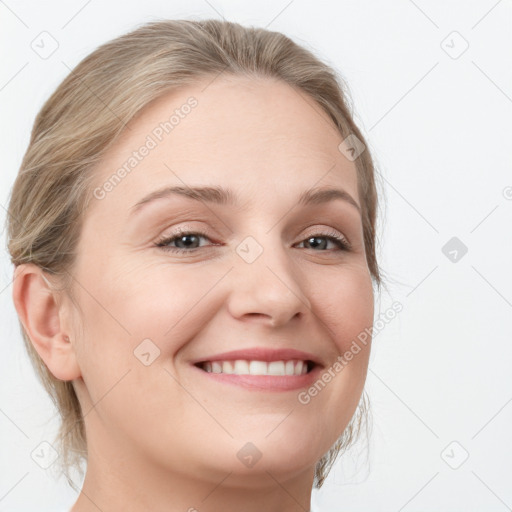 Joyful white young-adult female with long  brown hair and blue eyes