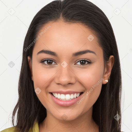 Joyful latino young-adult female with long  brown hair and brown eyes