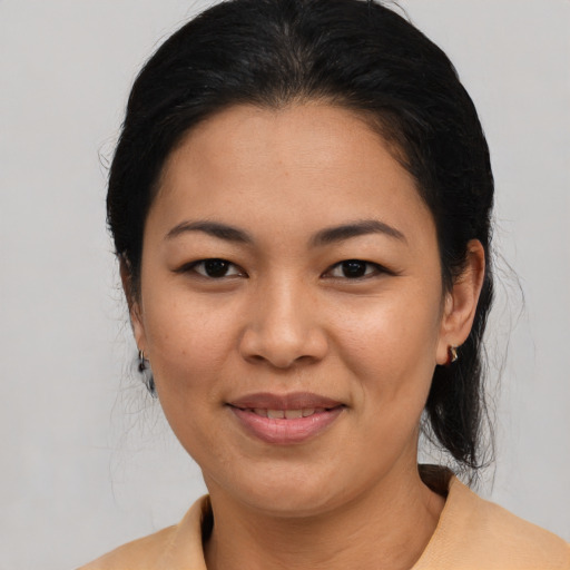 Joyful asian young-adult female with medium  brown hair and brown eyes