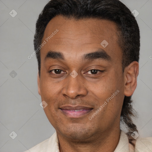 Joyful latino adult male with short  black hair and brown eyes