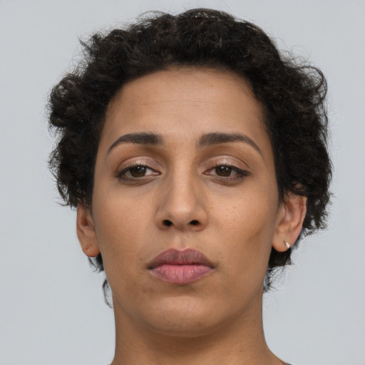 Neutral latino young-adult female with short  brown hair and brown eyes