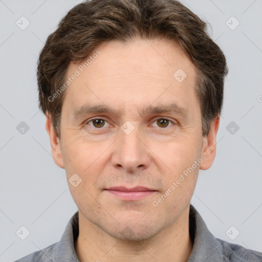 Joyful white adult male with short  brown hair and grey eyes