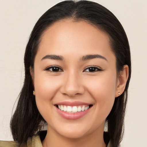 Joyful white young-adult female with long  brown hair and brown eyes