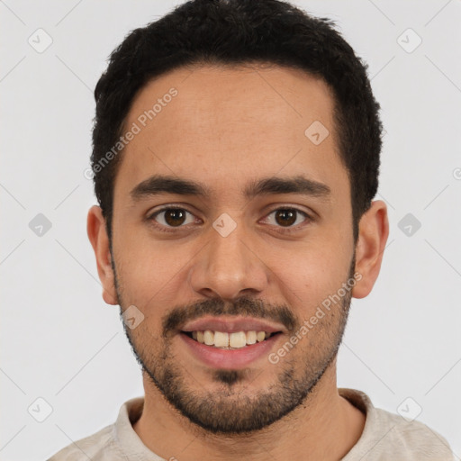 Joyful white young-adult male with short  black hair and brown eyes