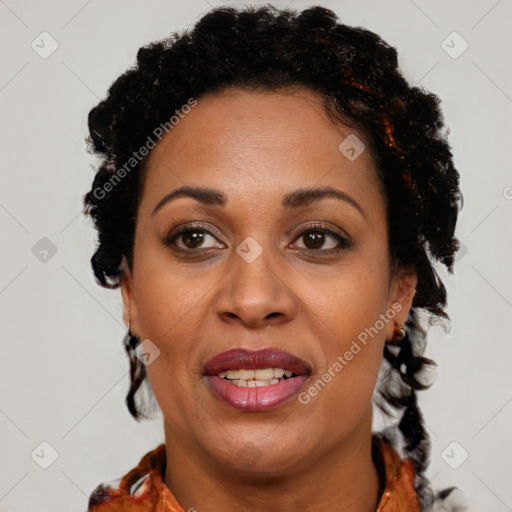 Joyful black adult female with short  brown hair and brown eyes