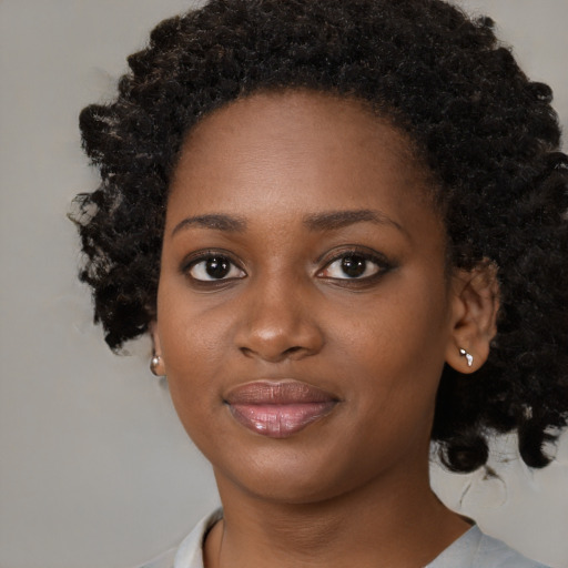 Joyful black young-adult female with medium  black hair and brown eyes