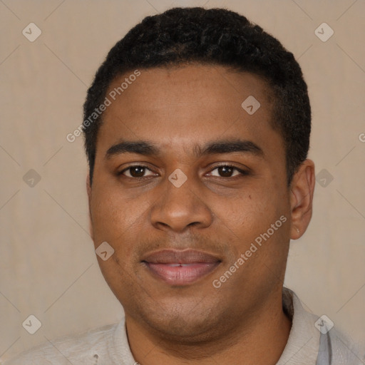 Joyful black young-adult male with short  black hair and brown eyes