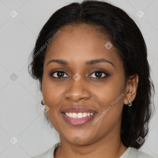 Joyful black young-adult female with medium  brown hair and brown eyes