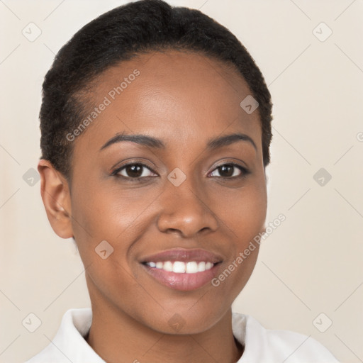 Joyful black young-adult female with short  brown hair and brown eyes