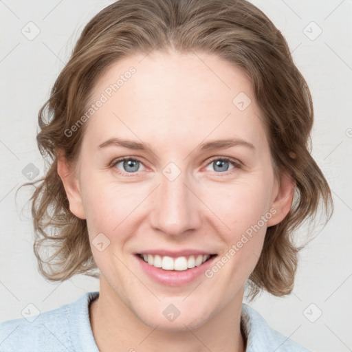 Joyful white young-adult female with medium  brown hair and blue eyes