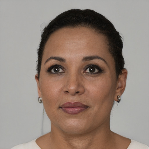 Joyful black adult female with short  brown hair and brown eyes