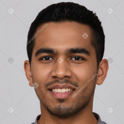 Joyful latino young-adult male with short  black hair and brown eyes