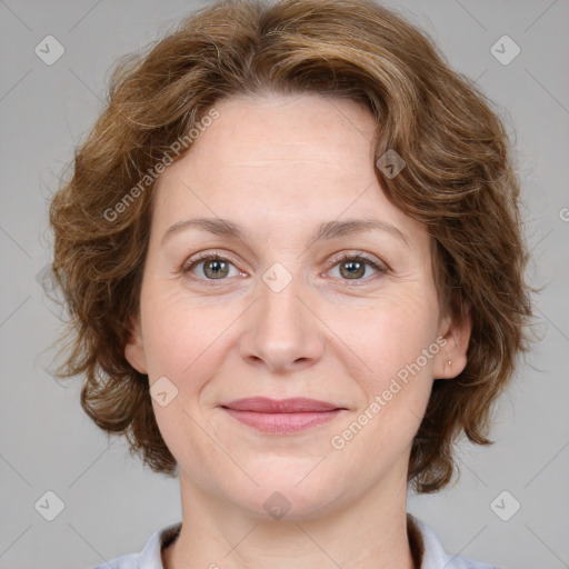 Joyful white young-adult female with medium  brown hair and green eyes