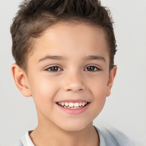 Joyful white child male with short  brown hair and brown eyes