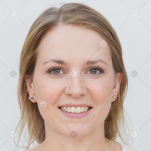 Joyful white young-adult female with medium  brown hair and blue eyes