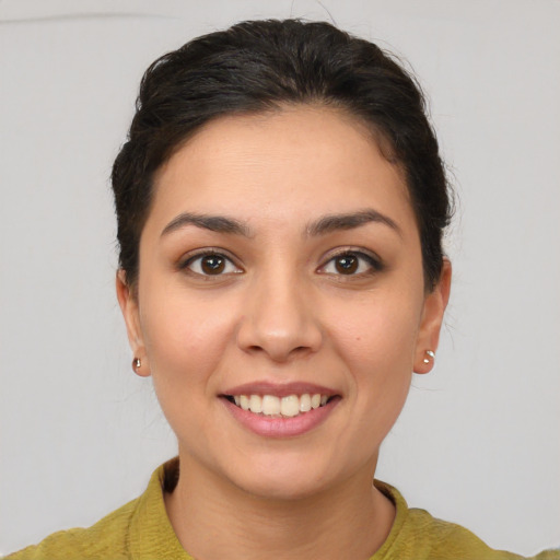 Joyful white young-adult female with short  brown hair and brown eyes