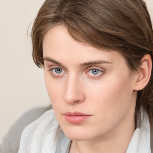 Neutral white young-adult female with medium  brown hair and grey eyes