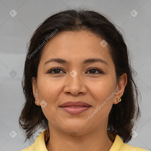 Joyful latino young-adult female with medium  brown hair and brown eyes