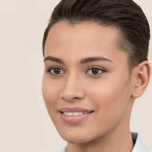 Joyful white young-adult female with short  brown hair and brown eyes