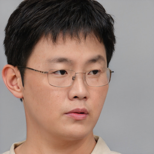 Neutral asian young-adult male with short  brown hair and brown eyes