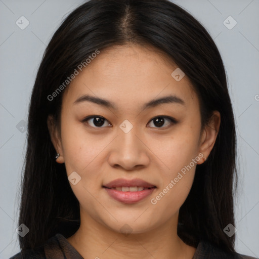 Joyful asian young-adult female with long  brown hair and brown eyes