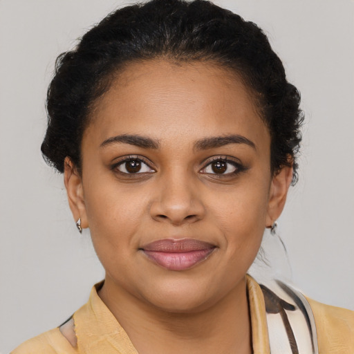 Joyful latino young-adult female with medium  brown hair and brown eyes