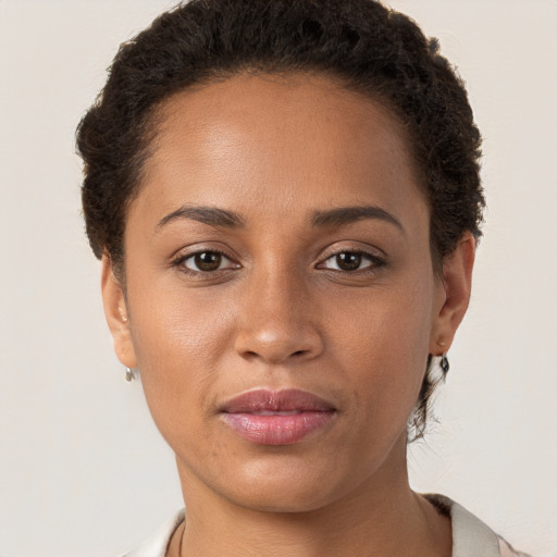 Joyful white young-adult female with short  brown hair and brown eyes