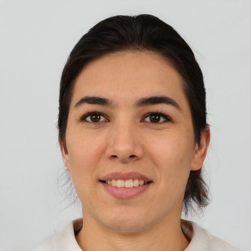 Joyful asian young-adult female with medium  brown hair and brown eyes