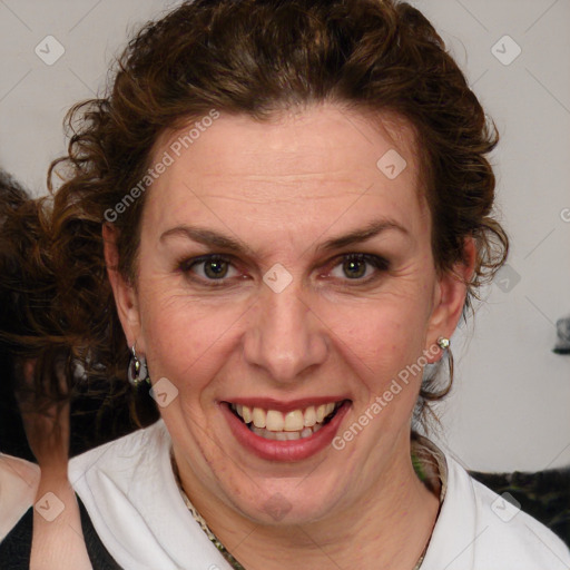 Joyful white adult female with medium  brown hair and blue eyes