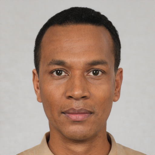 Neutral black young-adult male with short  black hair and brown eyes