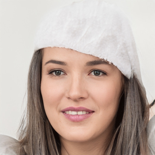 Joyful white young-adult female with long  black hair and brown eyes