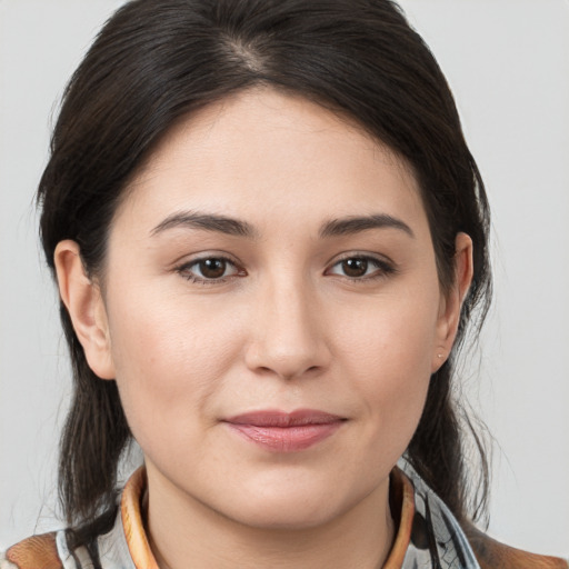 Joyful white young-adult female with medium  brown hair and brown eyes