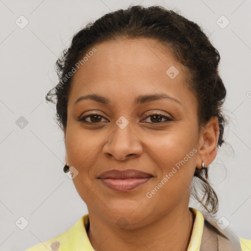 Joyful black adult female with short  brown hair and brown eyes