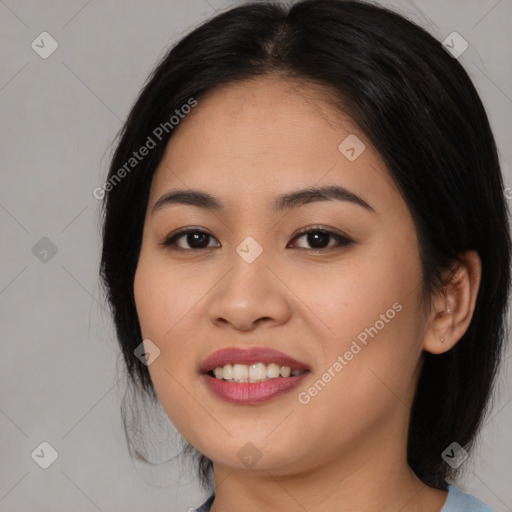 Joyful asian young-adult female with medium  black hair and brown eyes