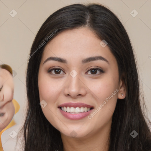 Joyful asian young-adult female with long  brown hair and brown eyes