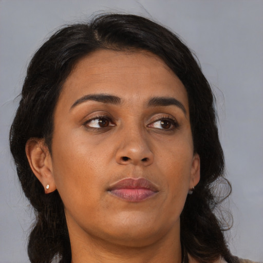 Joyful asian young-adult female with long  brown hair and brown eyes