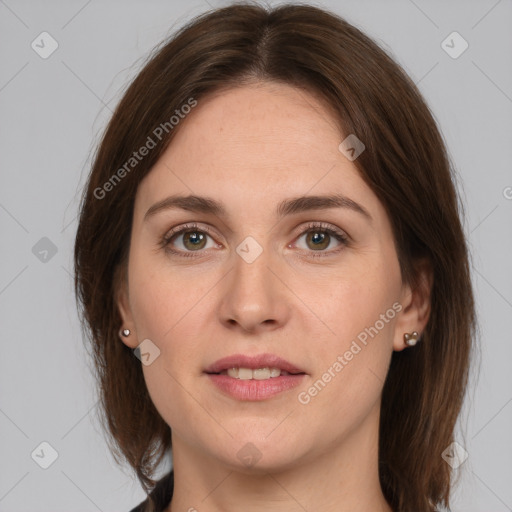 Joyful white young-adult female with medium  brown hair and grey eyes