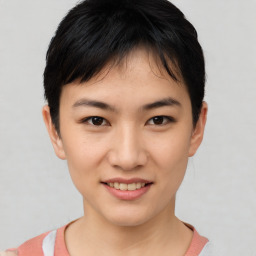 Joyful asian young-adult female with short  brown hair and brown eyes