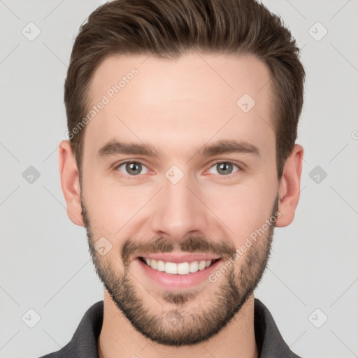 Joyful white young-adult male with short  brown hair and brown eyes