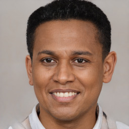 Joyful latino adult male with short  black hair and brown eyes
