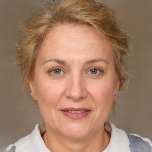 Joyful white middle-aged female with medium  brown hair and brown eyes