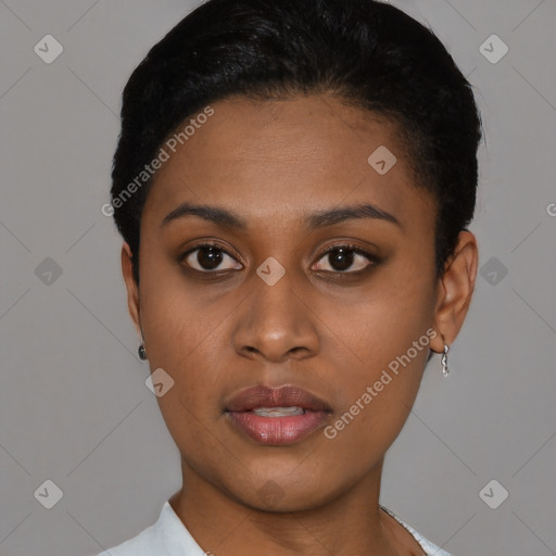 Joyful black young-adult female with short  black hair and brown eyes