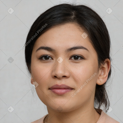 Joyful latino young-adult female with medium  brown hair and brown eyes