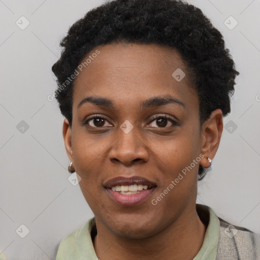 Joyful black young-adult female with short  black hair and brown eyes